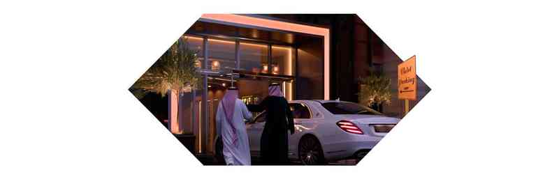 valet service page banner showing two men using the valet service