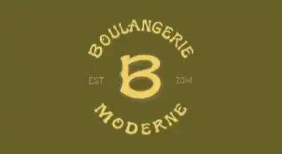 The image shows the Boulangerie Moderne logo. The text is in gold, and the background is green