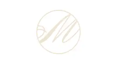 The image shows the Maru Chocolatier logo. The text is in gold, and the background is white
