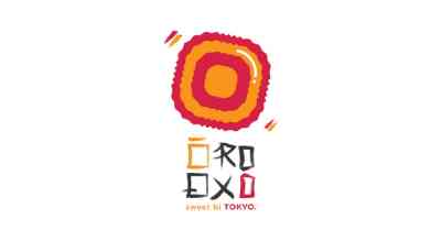 The image shows a simple logo with an orange and red circle, and below it the text “sweet bi TOKYO.” written in a modern style that resembles Japanese characters.