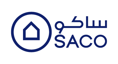 SACO logo showing the a circle with a house insideit and the words SACO in both Arabic and English languges each in a line on its own next to the circle on the right side. all are in dark blue color