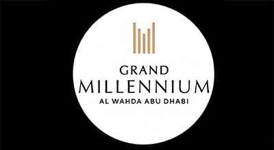 The image shows a logo with the name "Grand Millennium" written in gray letters.The background is white